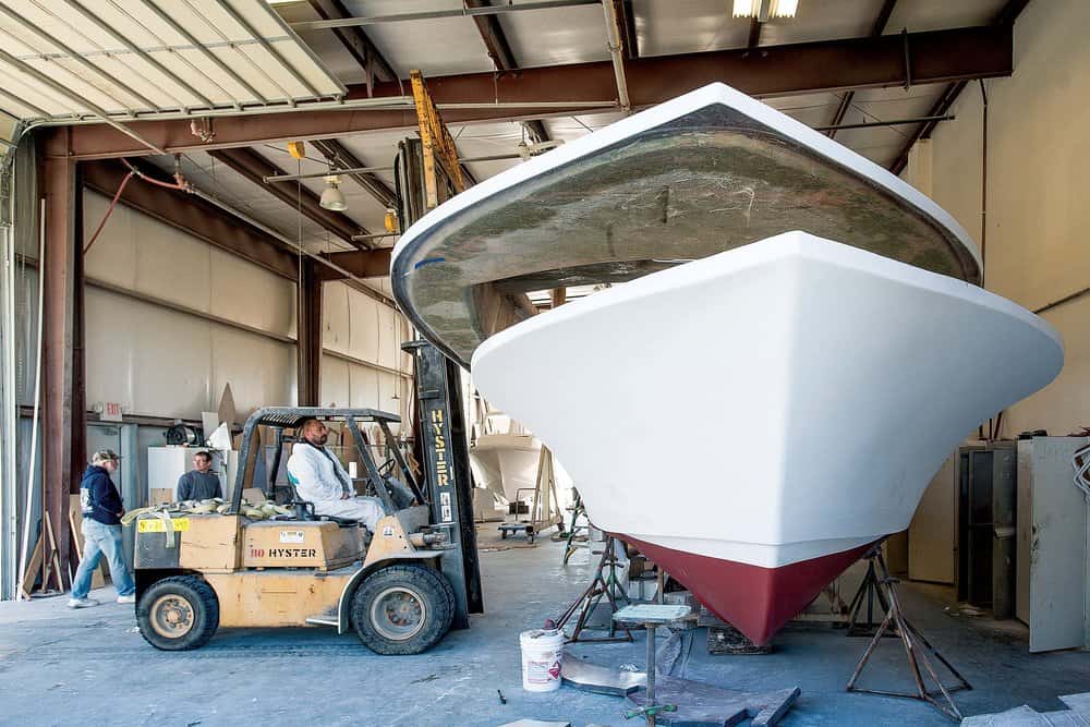   Judge Yachts— dropping the deck on. Photo by M ichael C. Wootton     