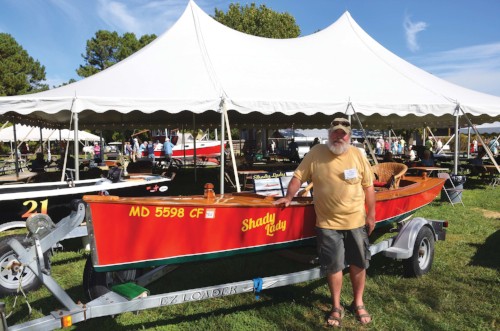  Karl Nisson shows off his home-built crab skiff outfitted with a customized wicker porch chair and a 20-hp, 625cc industrial compressor engine. Photo by Dick Cooper. 